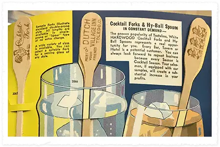 Vintage advertisement for cocktail forks and hy-ball spoons with wooden utensils and glasses.